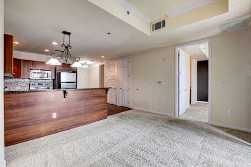 A large open room with a kitchen area in the background.