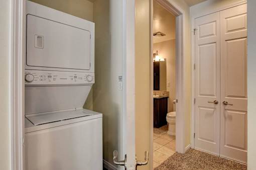 A white oven and dishwasher in a kitchen.