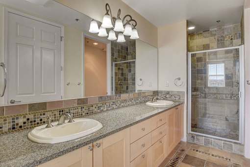 A bathroom with a sink and a mirror.