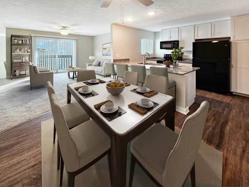 A modern dining room with a table set for six.