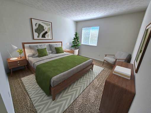 A bedroom with a large bed and a green blanket.