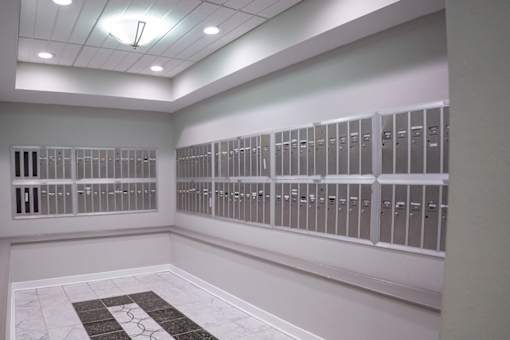 A room with a row of filing cabinets on the wall.