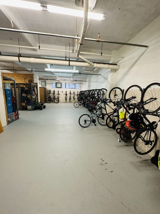 a large room with bikes on the wall