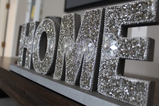 a close up of a glittery sign on a table