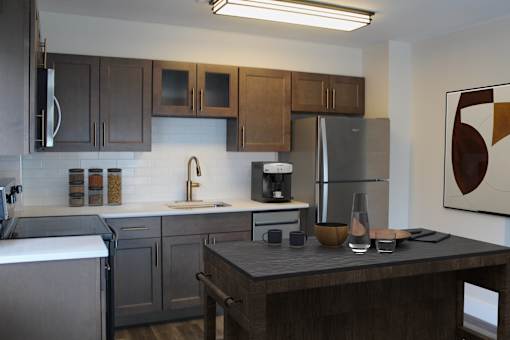 A modern kitchen with dark wood cabinets and stainless steel appliances.
