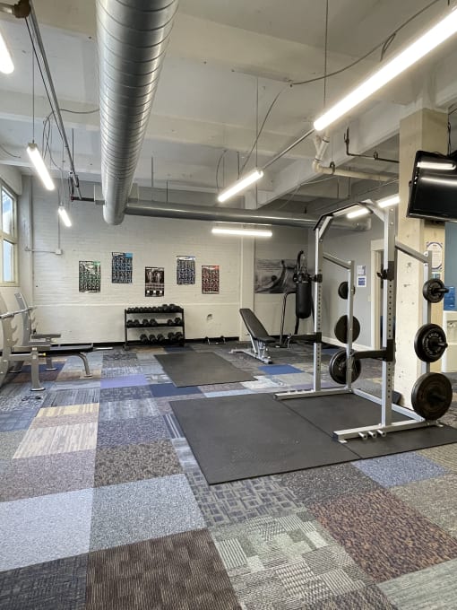 a view of the fitness center with weights machines and other exercise equipment