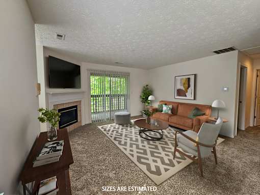 A living room with a fireplace and a couch.