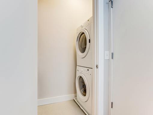 Two washing machines in a laundry room.