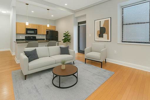 A modern living room with a white couch and a coffee table.