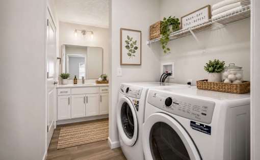 A laundry room with a washer and dryer.