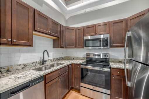 Kitchen with wooden cabinets at Shorehaus Lofts Apartments, Cleveland, 44113