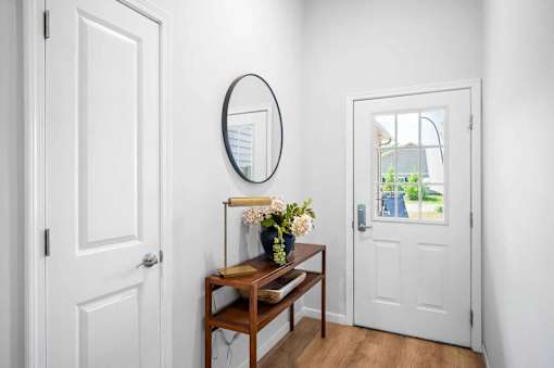 A white door is on the left and a white door is on the right.