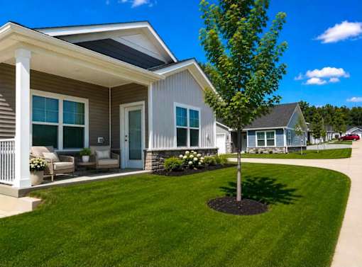 A house with a tree in front of it.