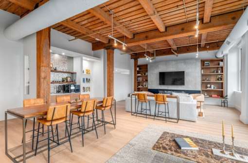 Living room with a wooden ceiling at Shorehaus Lofts Apartments, Cleveland