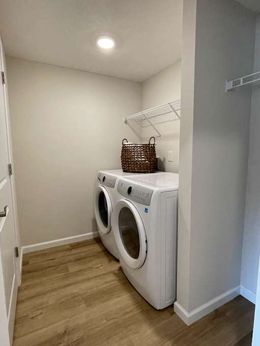 A small laundry room with a washer and dryer.