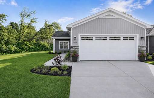 A modern house with a white garage door.
