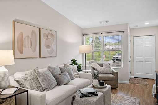 Living room with white couch at Concord Place Apartments, Ohio