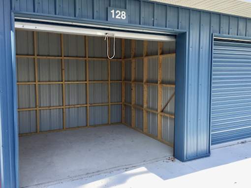 A garage with the number 128 on the top left corner.