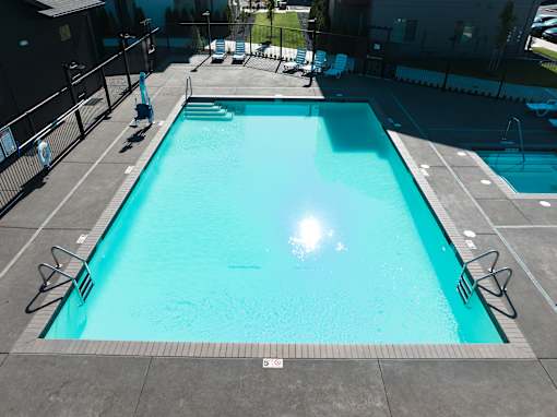 A large outdoor swimming pool at Eastpark Apartment Homes, Oregon