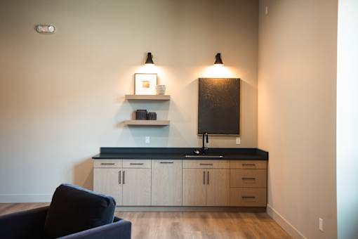 A kitchen with a black countertop and white cabinets.at Eastpark Apartment Homes, Salem, OR 97301
