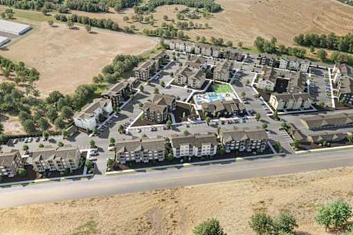 A bird's eye view of a residential area with houses and a swimming pool.