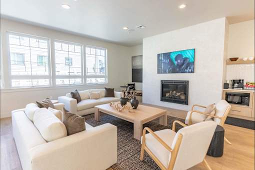 A modern living room with a fireplace and a television.