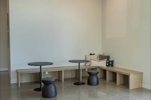 A room with a table and a bench.