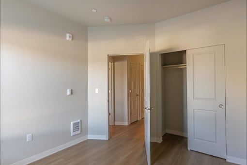 A room with a doorway leading to another room at Cascade Place Apartment Homes, Molalla, 97038