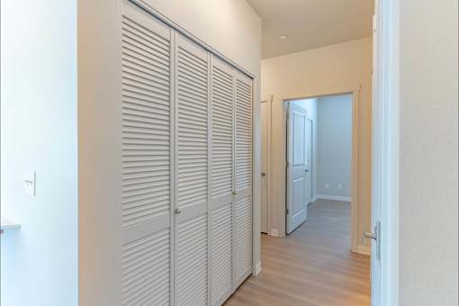 Closet with white doors in a room at Cascade Place Apartment Homes, Molalla, OR, 97038