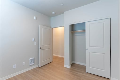 A room with a white door and a white wall with switches at Cascade Place Apartment Homes, Molalla, OR