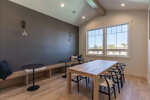 A dining room with a wooden table and chairs at Cascade Place Apartment Homes, Molalla, OR