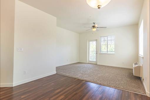 A room with a ceiling fan and a rug on the floor at Riverplace Apartment Homes, Oregon, 97351