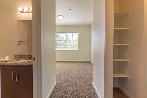 A room with a carpeted floor and a window at Riverplace Apartment Homes, Oregon, 97351