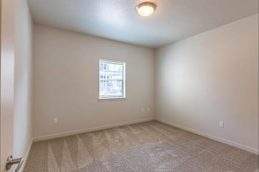 A room with a window and carpeted floor at Sandyplace Apartment Homes, Sandy, 97055