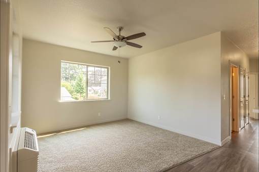 A room with a window and a ceiling fan at Sandyplace Apartment Homes, Sandy, Oregon