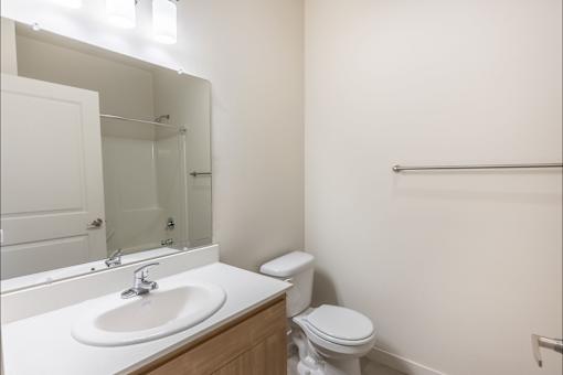 A white sink is on a countertop in a bathroom at Silverplace Apartment Homes, Silverton, Oregon