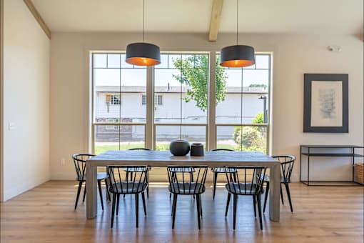 A dining room with a table and chairs at St Helens Place Apartment Homes, St Helens