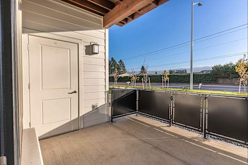 A white door is on the left side of the image at Woodburn Place Apartment Homes, Woodburn, OR, 97071