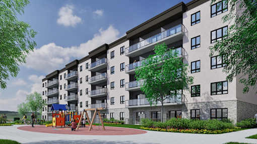 A large apartment building with a playground in front.