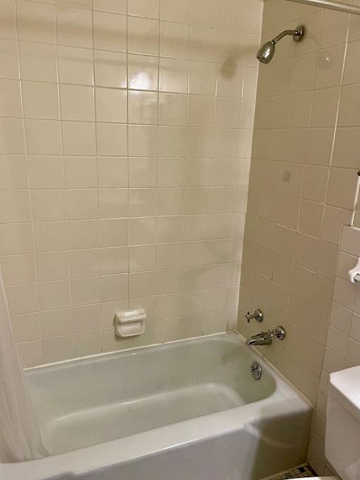 Ceramic shower surround.