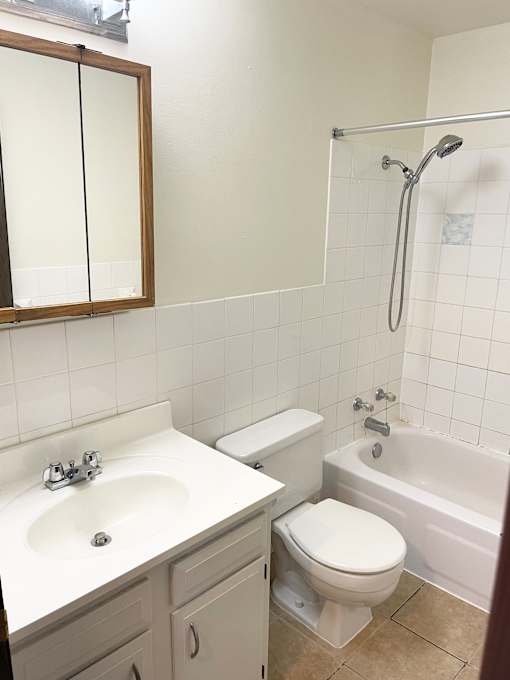 Ceramic tiled bathroom.
