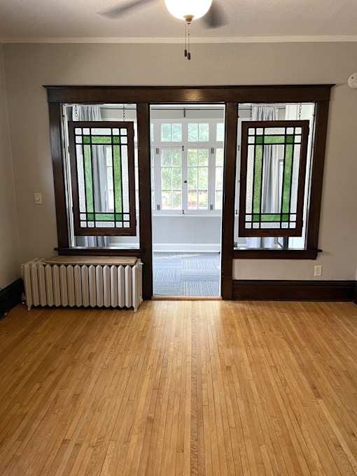 Stained glass separating living room from sun room/bedroom.