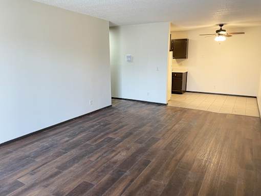 Sizeable living room with newly installed luxury plank flooring.