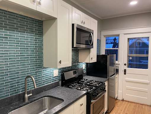 Unit 4 kitchen - updated with designer finishes and modern appliances.