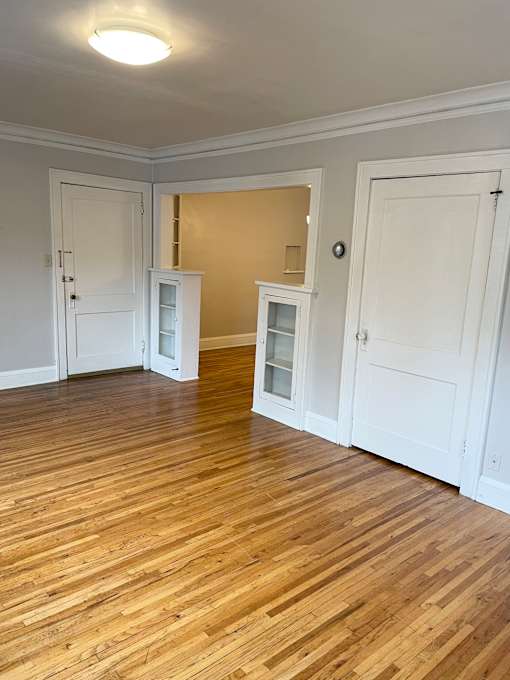 Original charm of hardwood floors and built-in hutches.