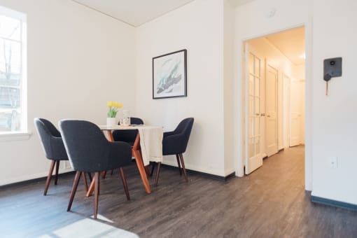 4-person dining in living area leads to hallway