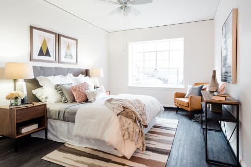 large bedroom with natural light and sitting area
