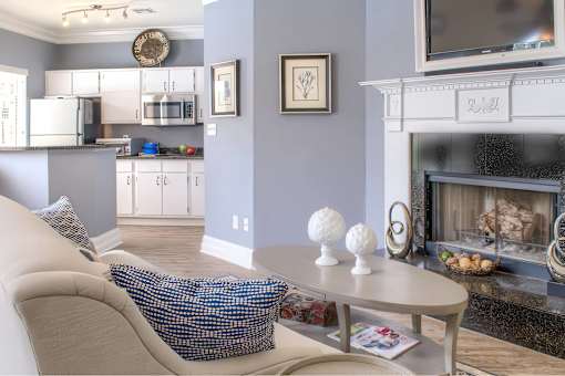 A living room with a fireplace and a couch.