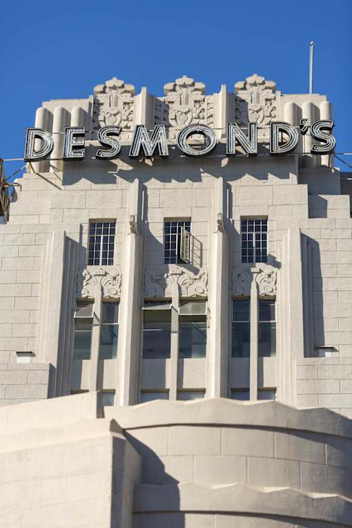 The DeSmonds building has a large sign on the top.
