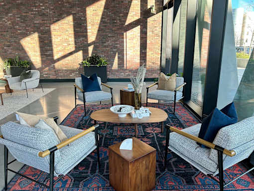 A cozy seating area with a wooden table and chairs.